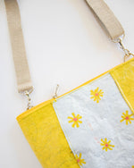 Water-resistant upcycled plastic sling bag | Unique daisy design